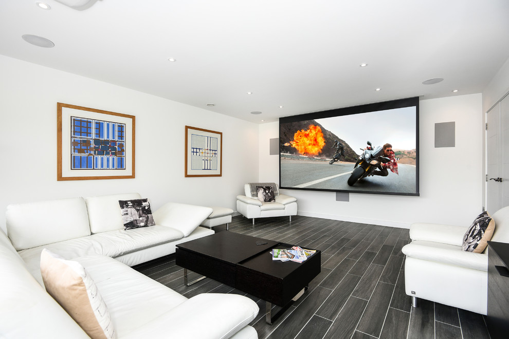 This is an example of a medium sized contemporary open plan living room in Buckinghamshire with white walls, ceramic flooring, no fireplace, a wall mounted tv and grey floors.