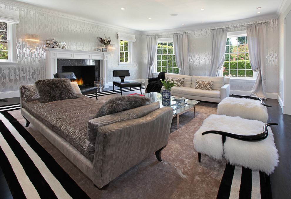 Expansive traditional formal open plan living room in Los Angeles with white walls, dark hardwood flooring, a standard fireplace, a stone fireplace surround and no tv.