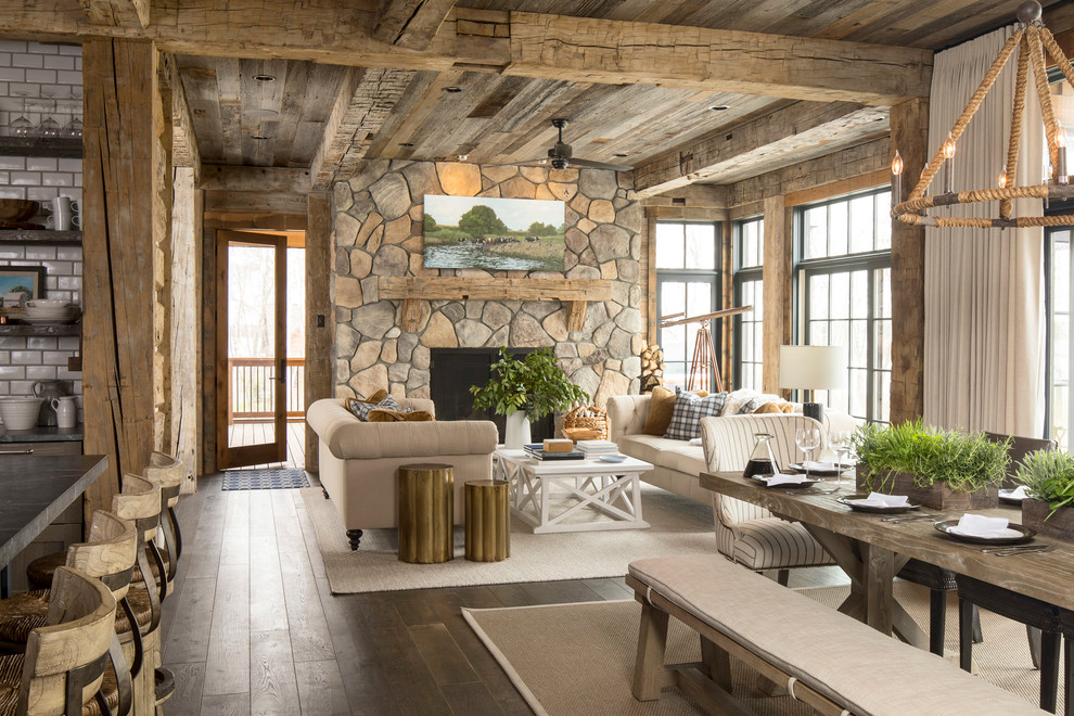 Large rustic formal open plan living room in Minneapolis with brown walls, carpet, no fireplace, no tv and beige floors.