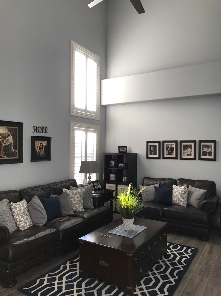 Inspiration for a medium sized classic enclosed living room in Las Vegas with grey walls, dark hardwood flooring, no fireplace, no tv and brown floors.