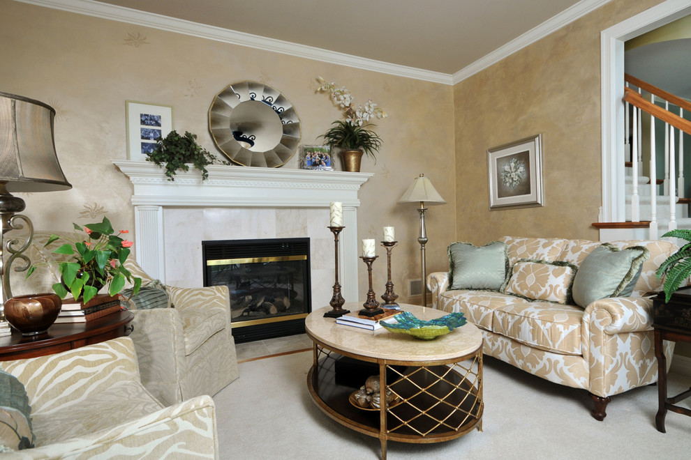 Photo of a classic open plan living room in New York with a standard fireplace, a tiled fireplace surround, beige walls and carpet.