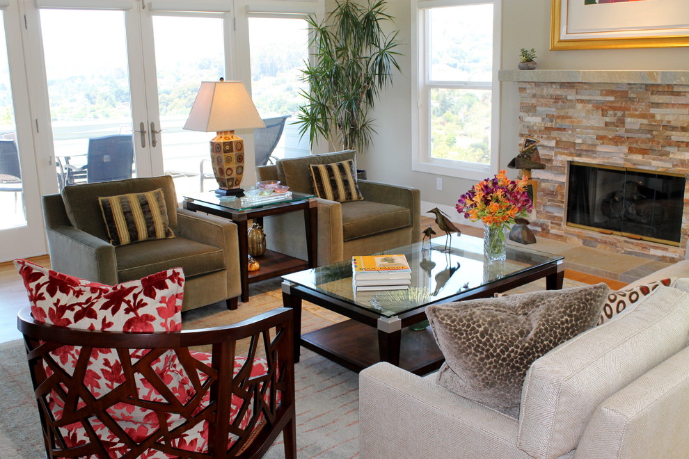 Inspiration for a large transitional open concept and formal light wood floor, multicolored floor and vaulted ceiling living room remodel in San Francisco with white walls, a standard fireplace, no tv and a stacked stone fireplace