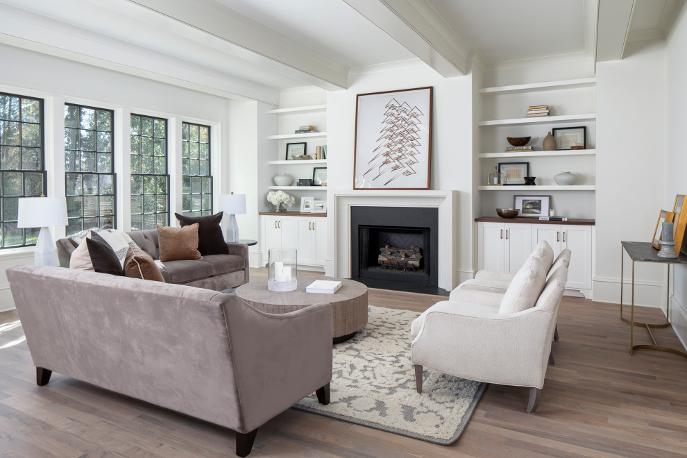 Photo of a medium sized traditional open plan living room in Charlotte with beige walls and medium hardwood flooring.