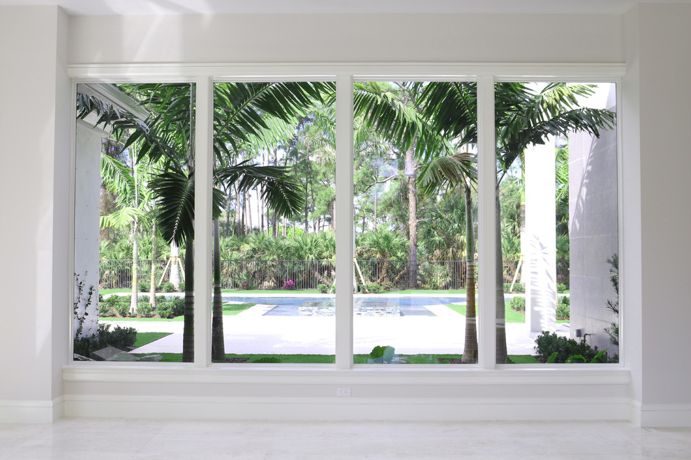 Living room pool view. Modern Living Room Miami by Franky