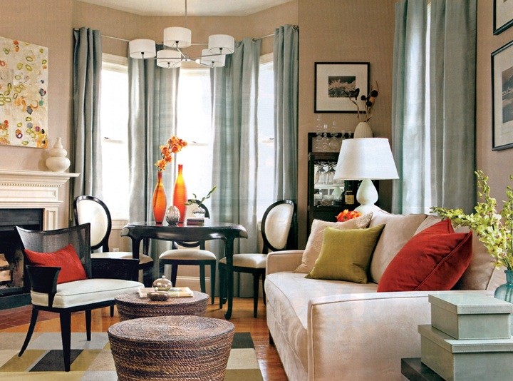 На фото: гостиная комната в стиле модернизм с бежевыми стенами, паркетным полом среднего тона, стандартным камином и фасадом камина из дерева без телевизора