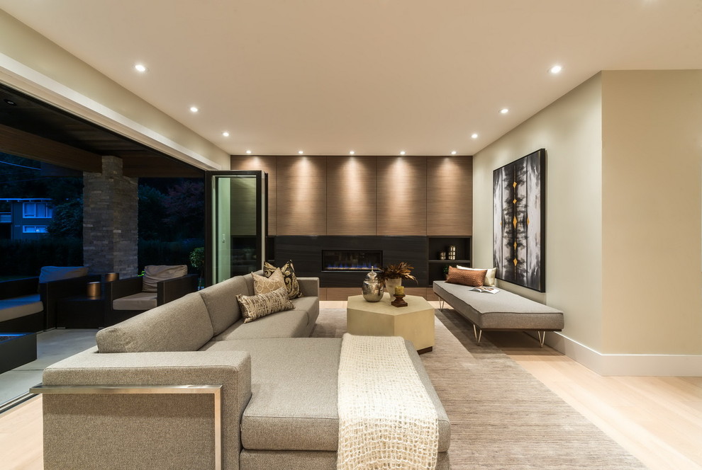 Inspiration for a large contemporary formal open plan living room in Vancouver with beige walls, light hardwood flooring, a ribbon fireplace and no tv.