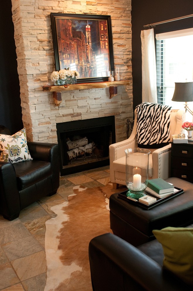 Small mountain style enclosed slate floor living room photo in Denver with blue walls, a standard fireplace and a stone fireplace