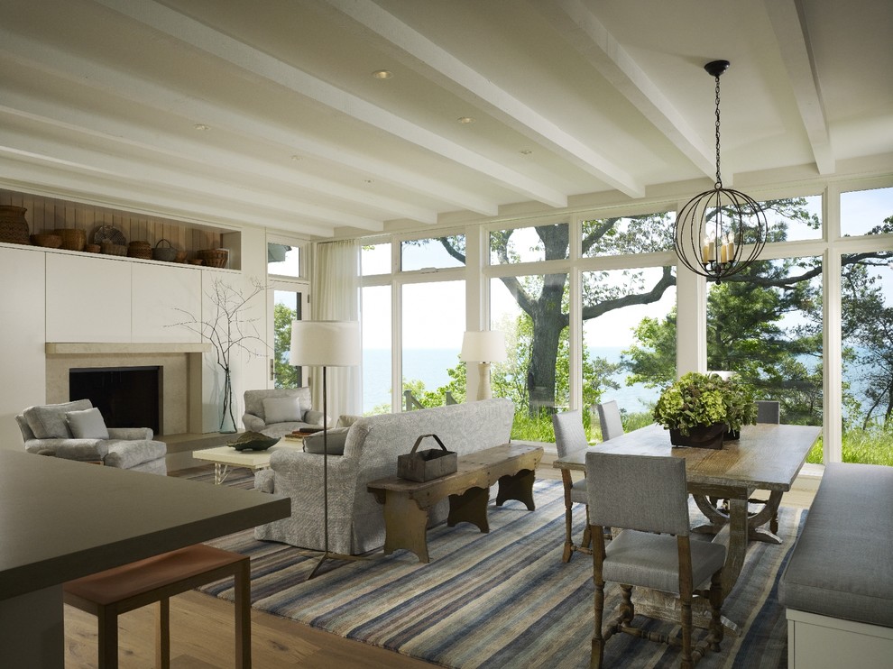 Transitional open concept light wood floor living room photo in Chicago with a standard fireplace and a stone fireplace