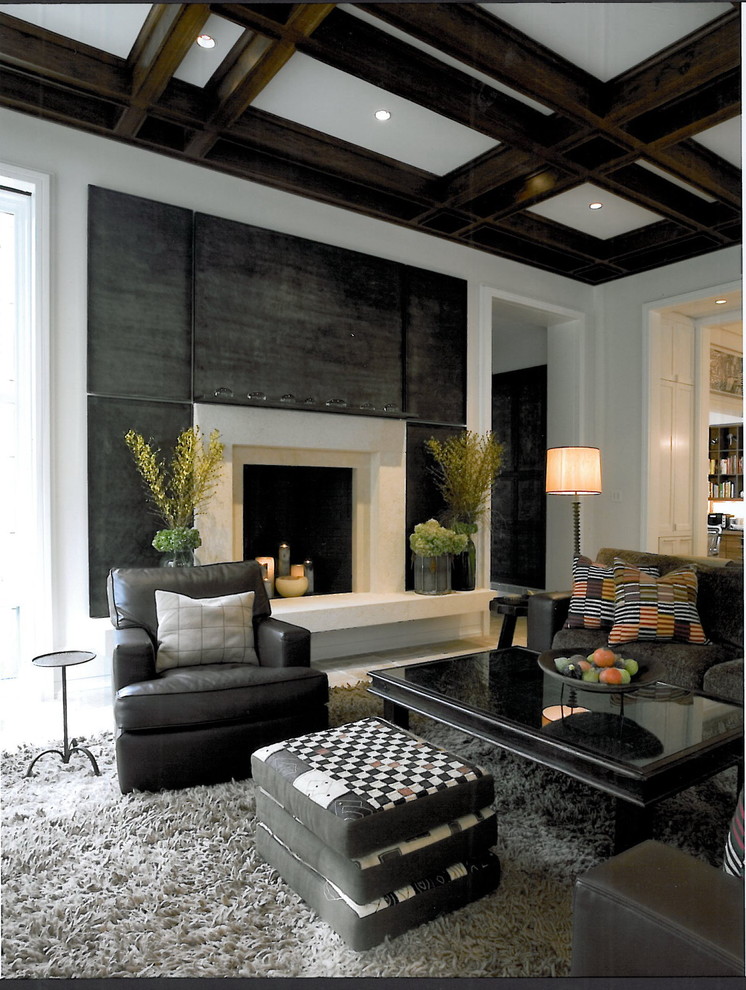 Photo of a contemporary living room in Chicago with a standard fireplace.