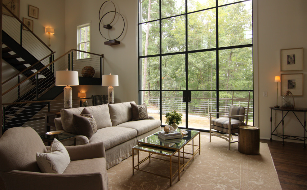 This is an example of a medium sized modern formal open plan living room in Atlanta with beige walls, dark hardwood flooring and brown floors.