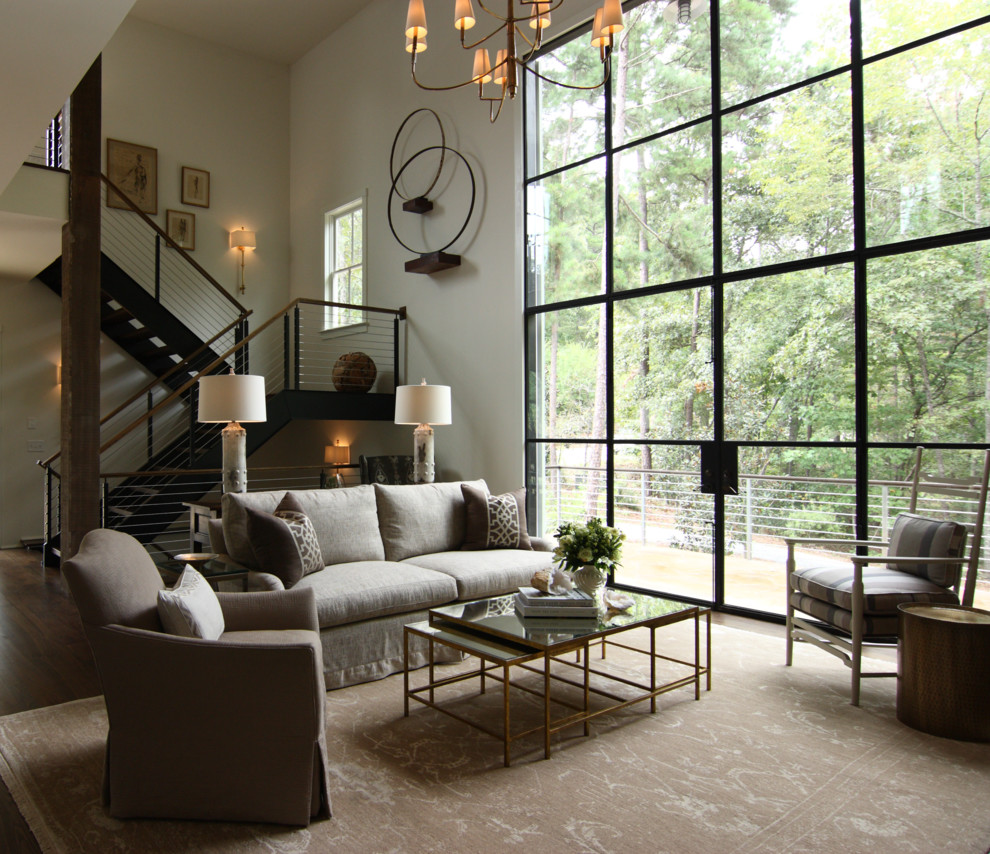 Example of a mid-sized minimalist formal and open concept dark wood floor and brown floor living room design in Atlanta with beige walls