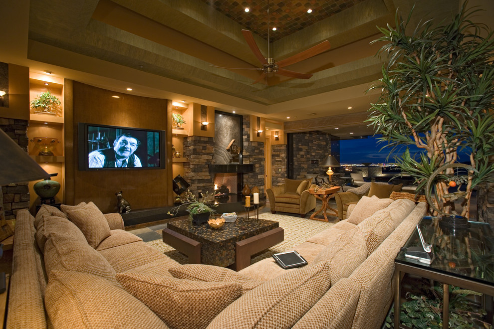Photo of an expansive classic formal open plan living room in Las Vegas with beige walls, a standard fireplace, a brick fireplace surround, a wall mounted tv, a vaulted ceiling and brick walls.