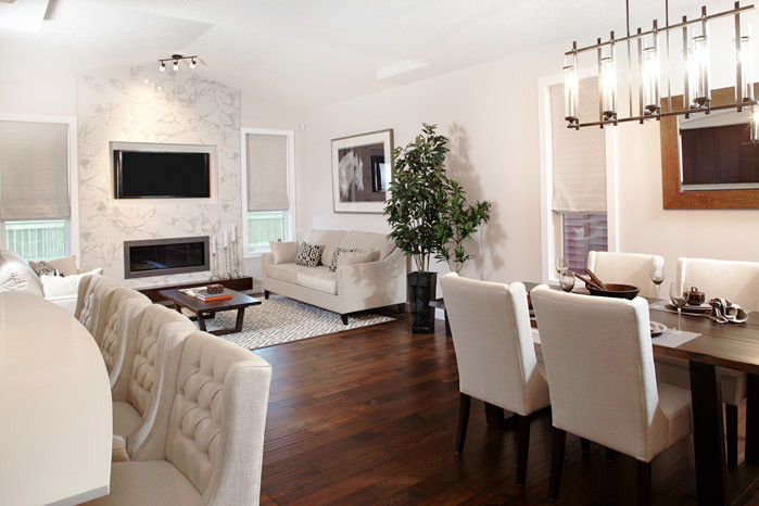 Inspiration for a mid-sized timeless open concept medium tone wood floor living room remodel in Calgary with white walls, a ribbon fireplace, a tile fireplace and a wall-mounted tv