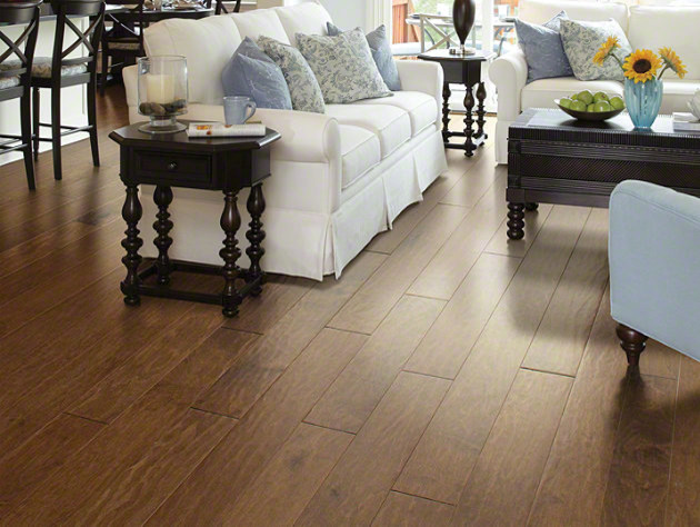 Elegant medium tone wood floor living room photo in Atlanta