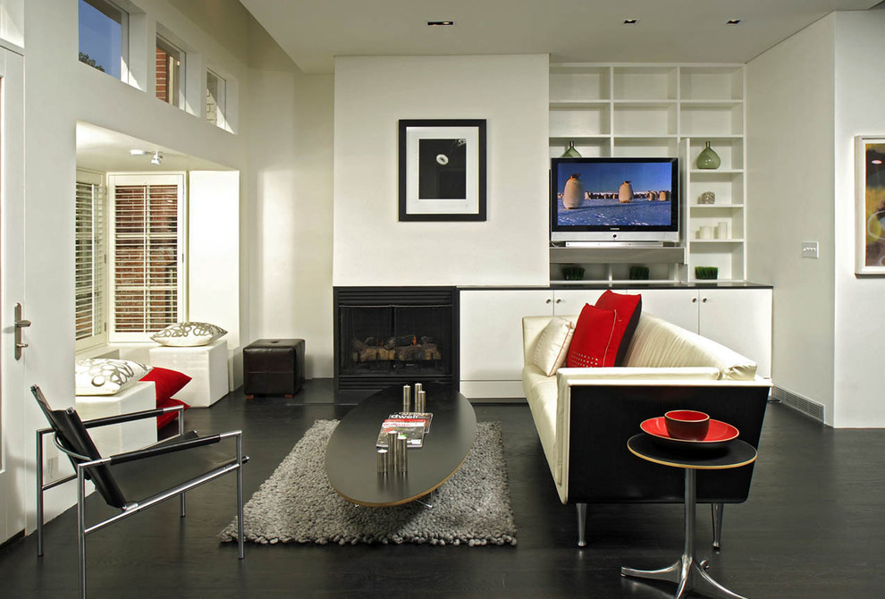 Inspiration for a modern open concept dark wood floor living room remodel in DC Metro with white walls, a corner fireplace and a plaster fireplace