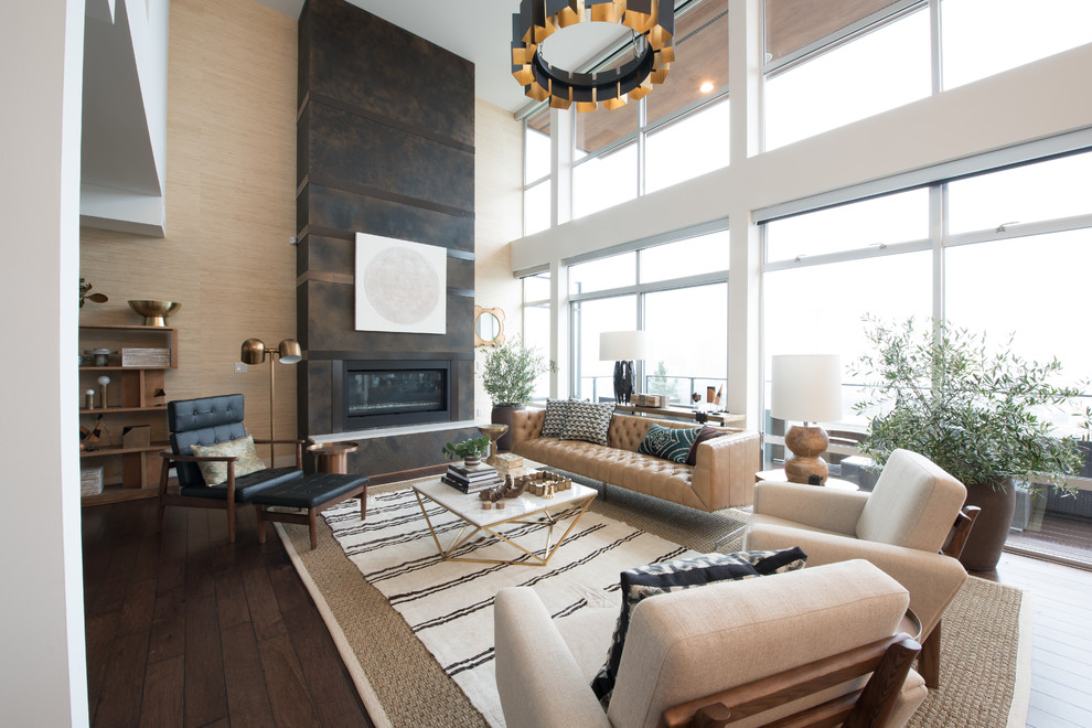 Exemple d'un grand salon rétro ouvert avec un mur beige, un sol en bois brun, une cheminée standard, un manteau de cheminée en bois et aucun téléviseur.