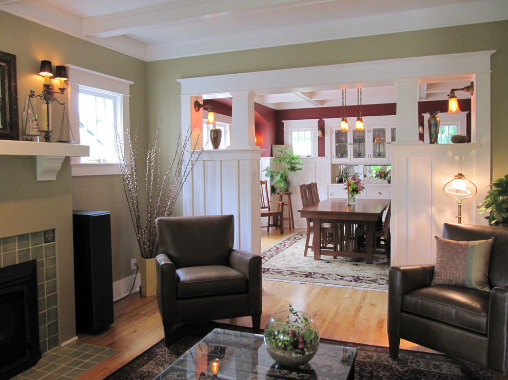 Living room - mid-sized craftsman open concept light wood floor living room idea in Seattle with green walls, a standard fireplace, a tile fireplace and no tv