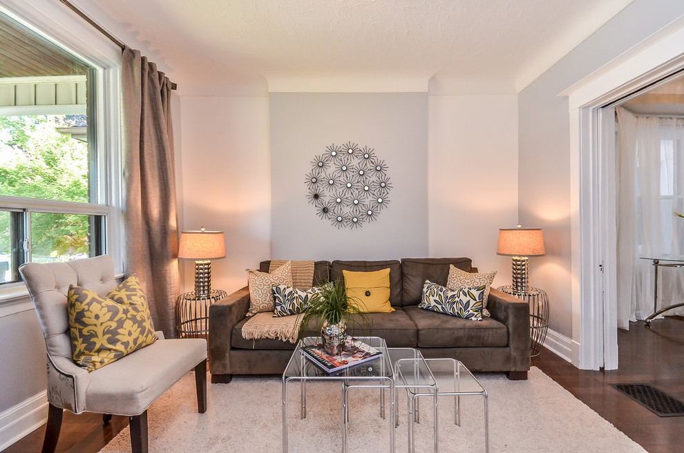 Example of a small trendy enclosed and formal dark wood floor living room design in Toronto with gray walls, no fireplace and no tv