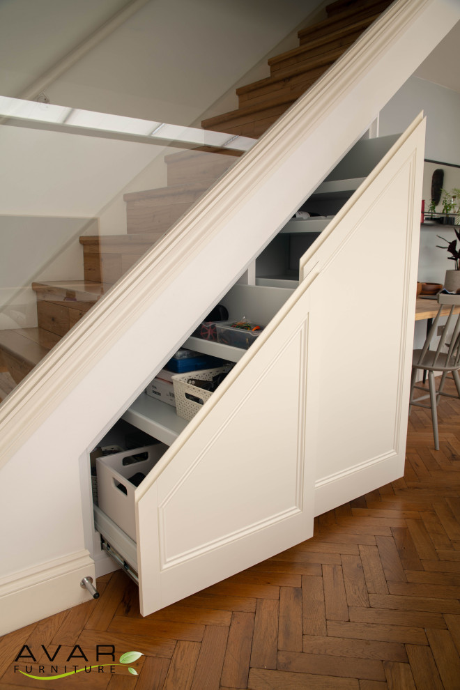 Living room under stairs storage Traditional Staircase London