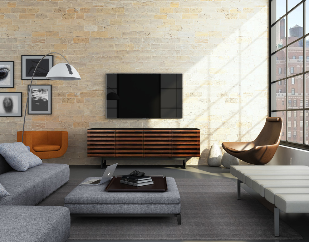 Inspiration for a medium sized urban formal open plan living room in Miami with beige walls, concrete flooring, no fireplace, a wall mounted tv and grey floors.
