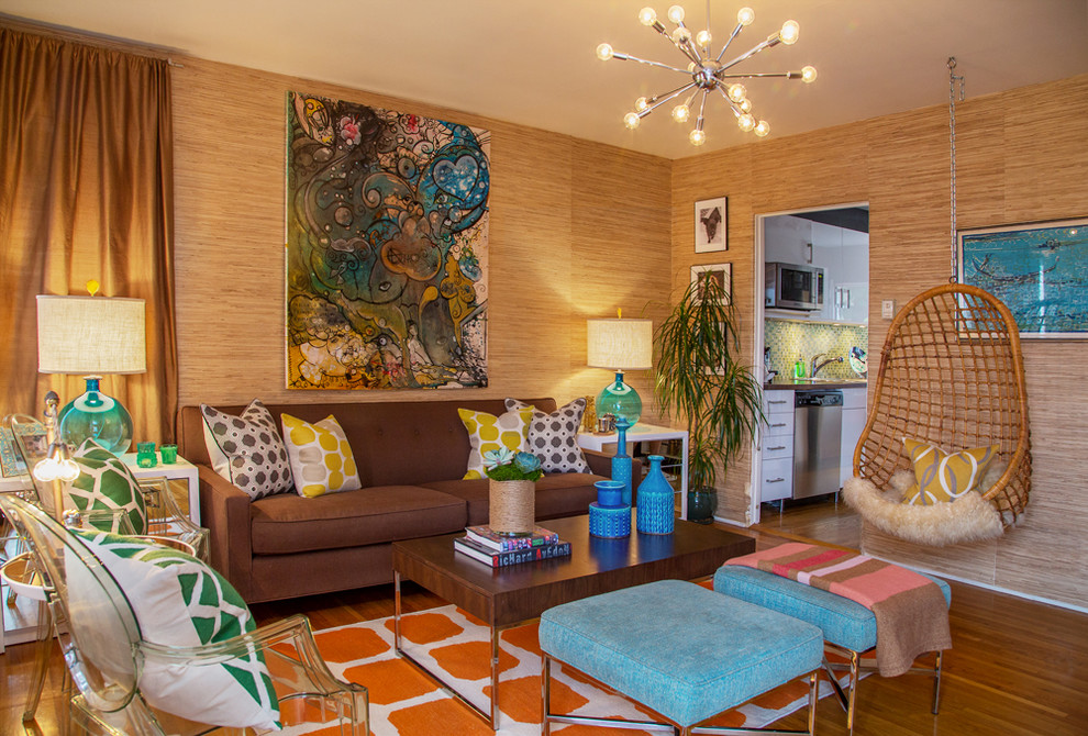 Inspiration for an eclectic enclosed medium tone wood floor living room remodel in Los Angeles with beige walls