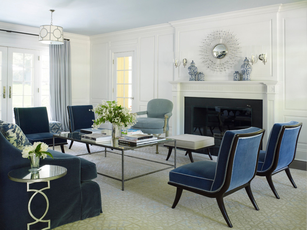 Classic formal living room in New York with white walls and a standard fireplace.