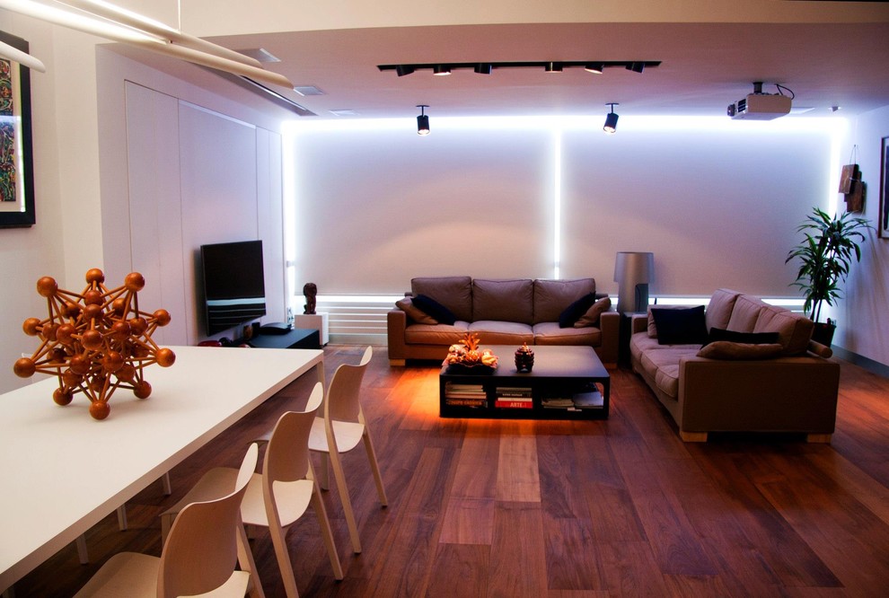 Large minimalist medium tone wood floor living room photo in San Francisco with white walls