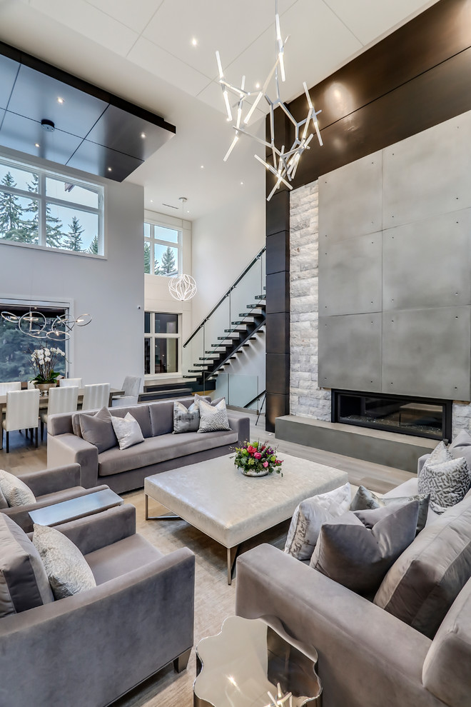 This is an example of a contemporary open plan living room in Calgary with multi-coloured walls, a ribbon fireplace and a brick fireplace surround.