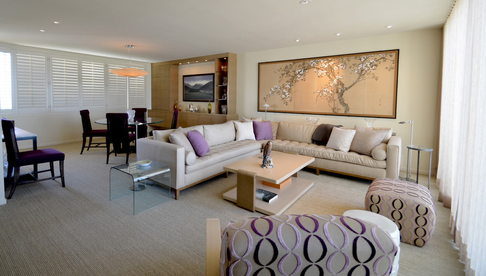Contemporary open plan living room in San Francisco with beige walls and carpet.