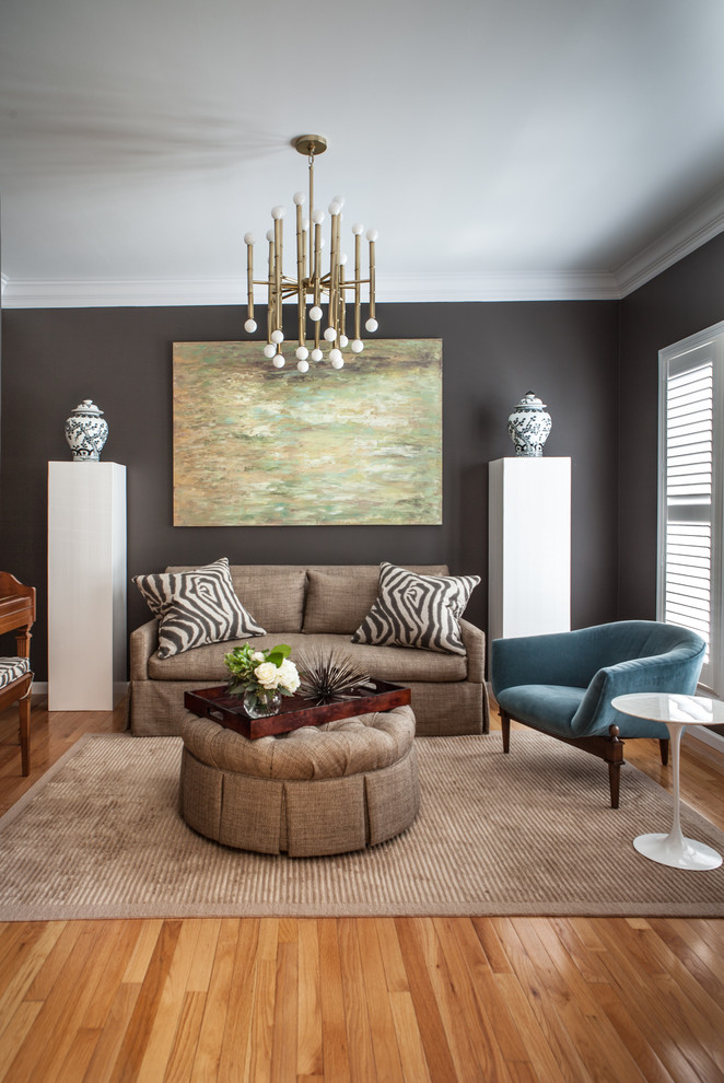 This is an example of a medium sized classic formal open plan living room in St Louis with grey walls, medium hardwood flooring, no fireplace, no tv and brown floors.