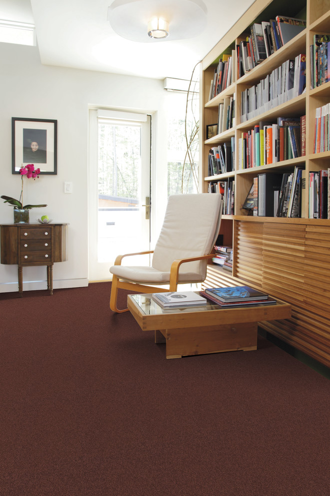 Trendy enclosed carpeted living room library photo in Jacksonville with white walls