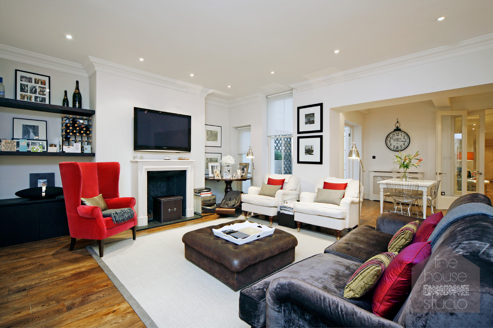 Large elegant formal and open concept medium tone wood floor living room photo in London with white walls, a standard fireplace, a stone fireplace and a wall-mounted tv