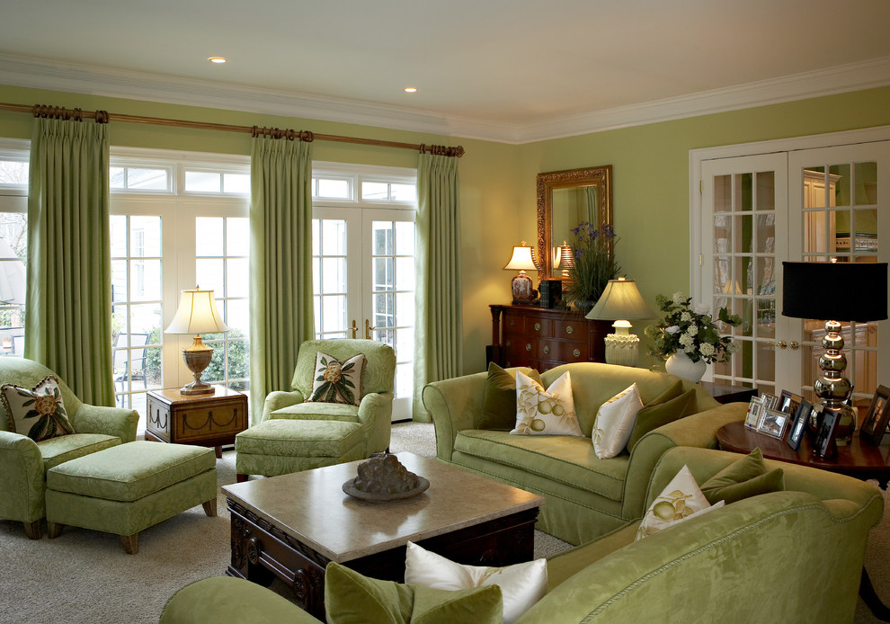 Photo of a large classic formal enclosed living room in Other with green walls and carpet.