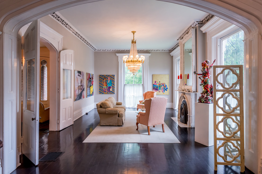 Living room - traditional formal and enclosed dark wood floor living room idea in Other with beige walls, a standard fireplace, a stone fireplace and no tv