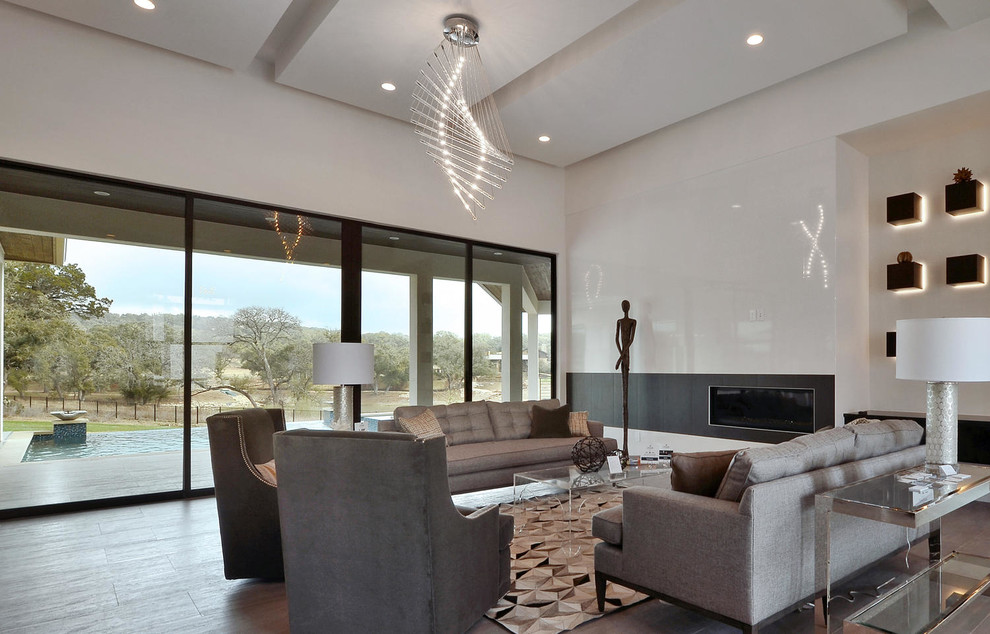 Large contemporary formal living room in Austin with white walls, a ribbon fireplace and no tv.