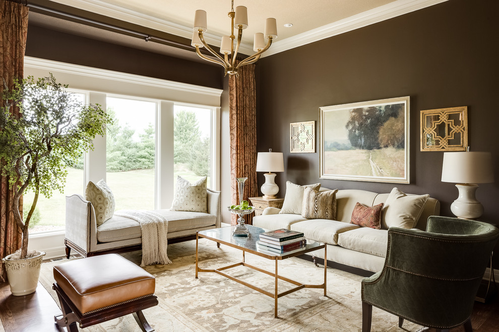 Example of a mid-sized classic formal and enclosed medium tone wood floor living room design in Kansas City with brown walls, no fireplace and no tv