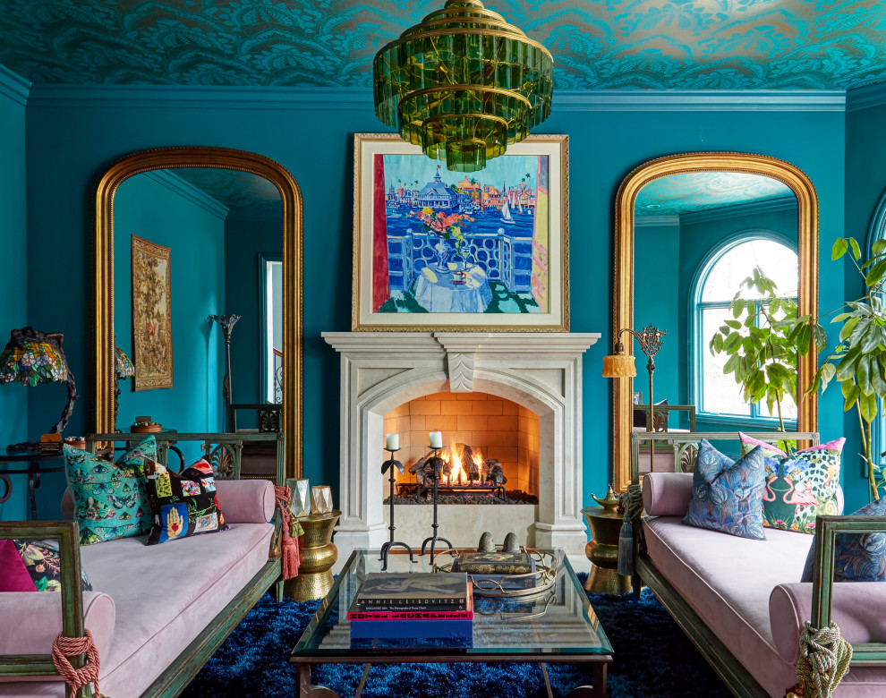 Transitional blue floor and wallpaper ceiling living room photo in Chicago with blue walls, a standard fireplace and a stone fireplace