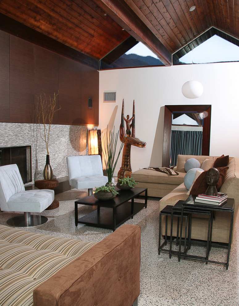 Contemporary living room in Los Angeles with a tiled fireplace surround.