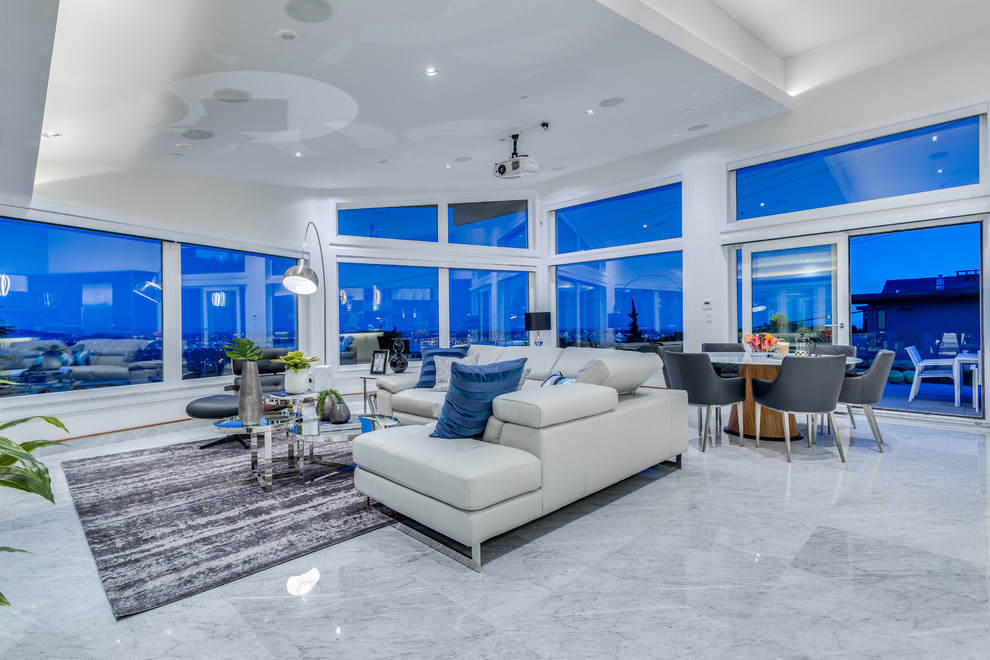 Immagine di un ampio soggiorno design aperto con pareti bianche e pavimento in marmo