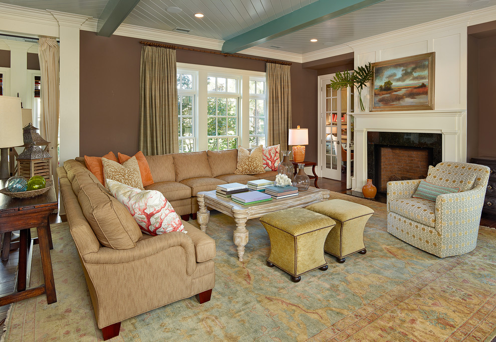 Design ideas for a beach style living room in Charleston with brown walls.