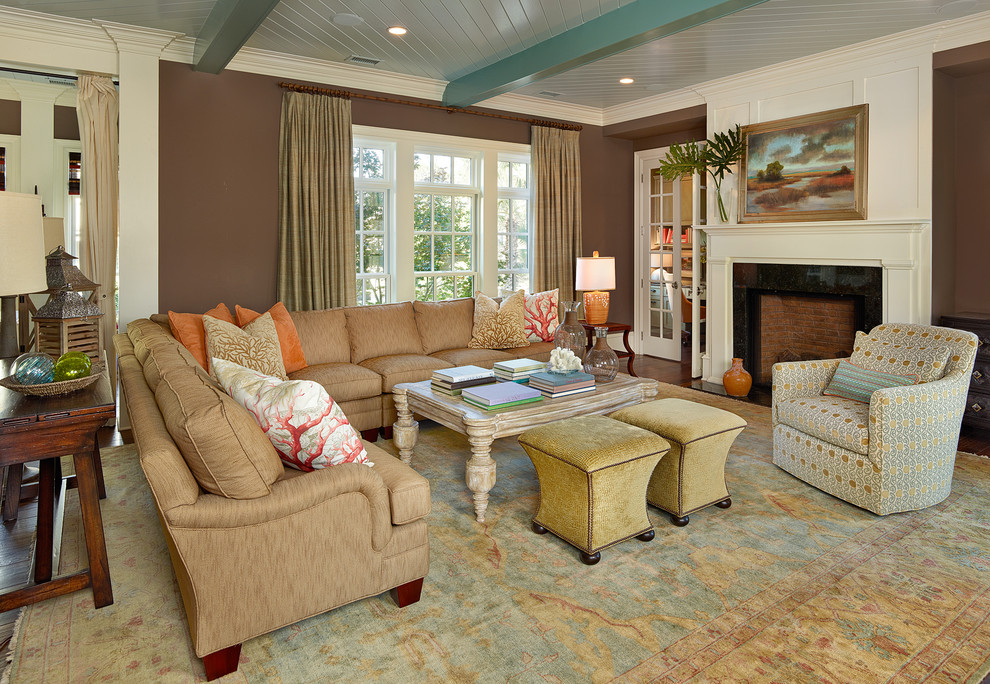 Living room - coastal living room idea in Charleston with brown walls