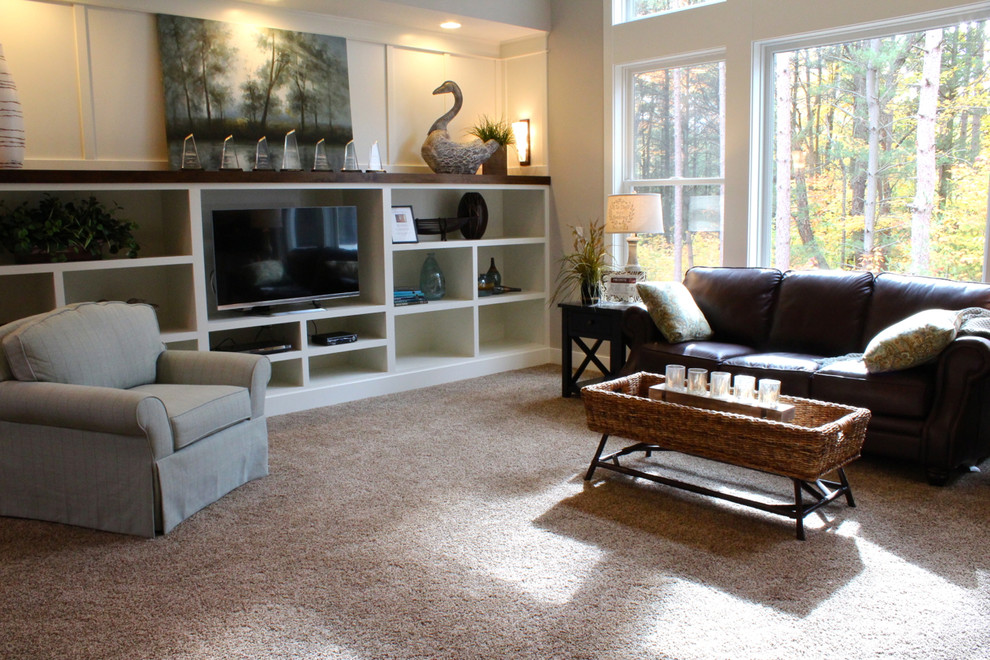 Elegant open concept carpeted living room photo in Grand Rapids with white walls, no fireplace and a tv stand
