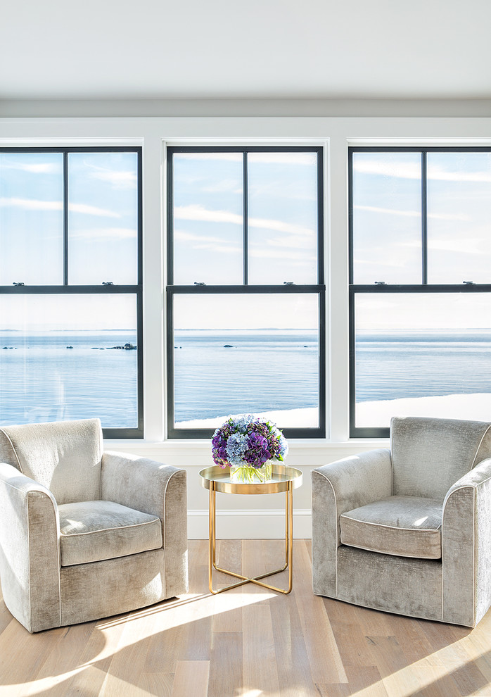Living room - contemporary formal light wood floor living room idea in New York with white walls