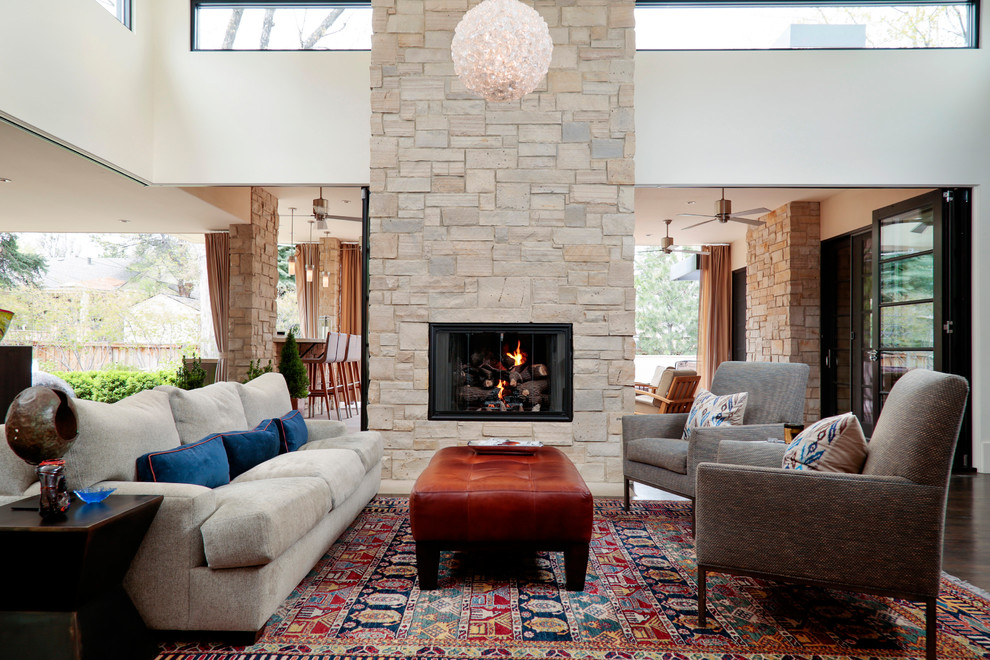 Inspiration for a contemporary formal open plan living room in Denver with dark hardwood flooring, a standard fireplace and a stone fireplace surround.
