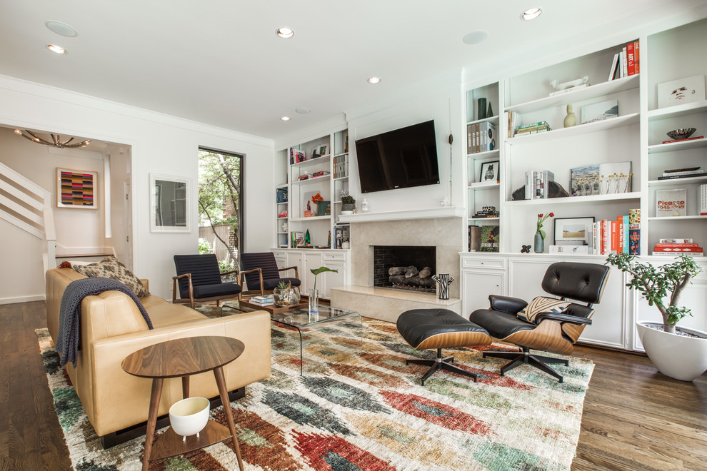 Inspiration for a transitional dark wood floor living room remodel in Dallas with white walls, a standard fireplace and a wall-mounted tv