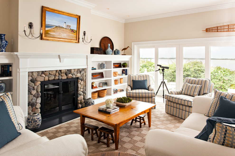 Large beach style formal enclosed living room in Boston with beige walls, carpet, a standard fireplace, a stone fireplace surround and no tv.