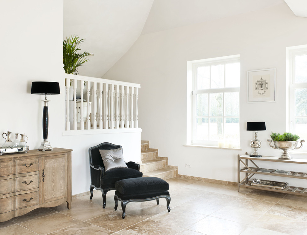 Example of an eclectic living room design in Amsterdam with white walls