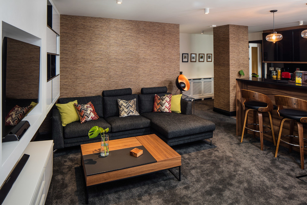 This is an example of a medium sized contemporary open plan living room in Dublin with brown walls, carpet, no fireplace and a freestanding tv.