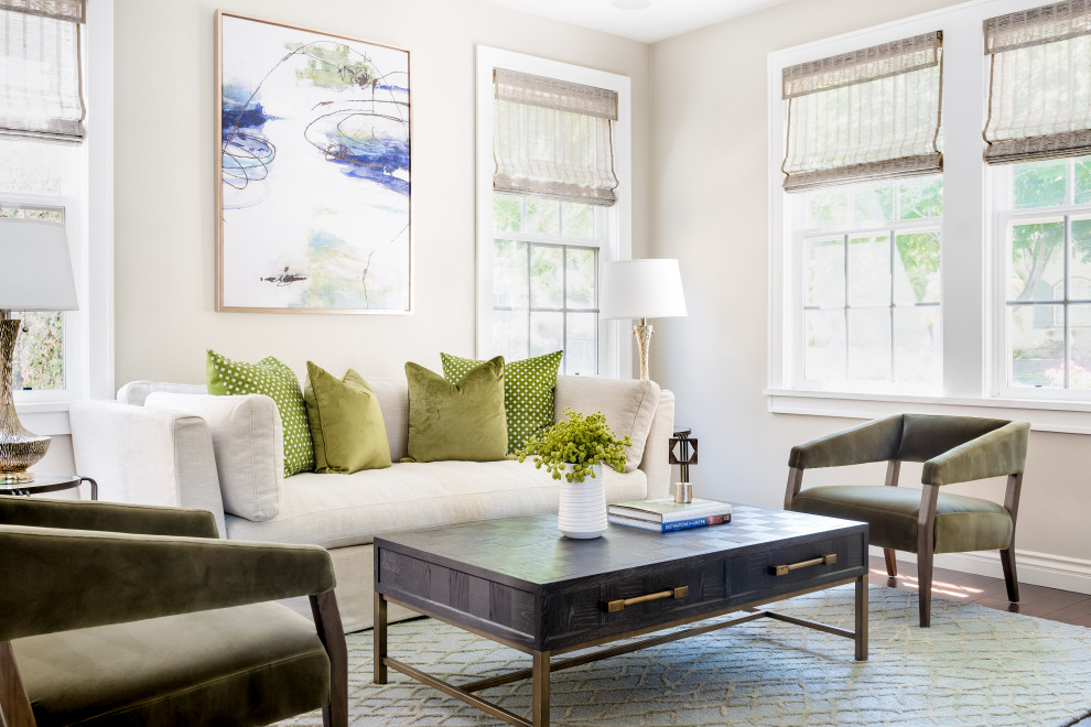 Example of a transitional formal medium tone wood floor and brown floor living room design in Orange County with beige walls