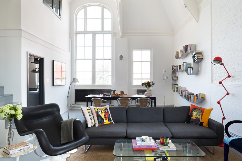 Inspiration for a large scandinavian living room in London with white walls.
